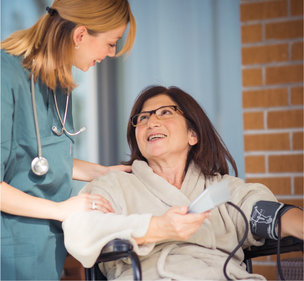 Private Nurse taking blood pressure from lady at home